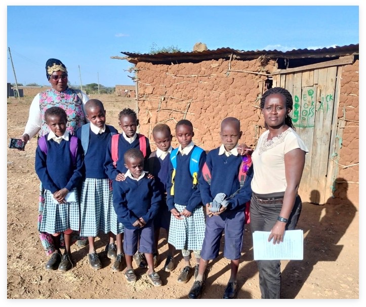 Schoolchildren and local community members together in Katorongot, Kenya