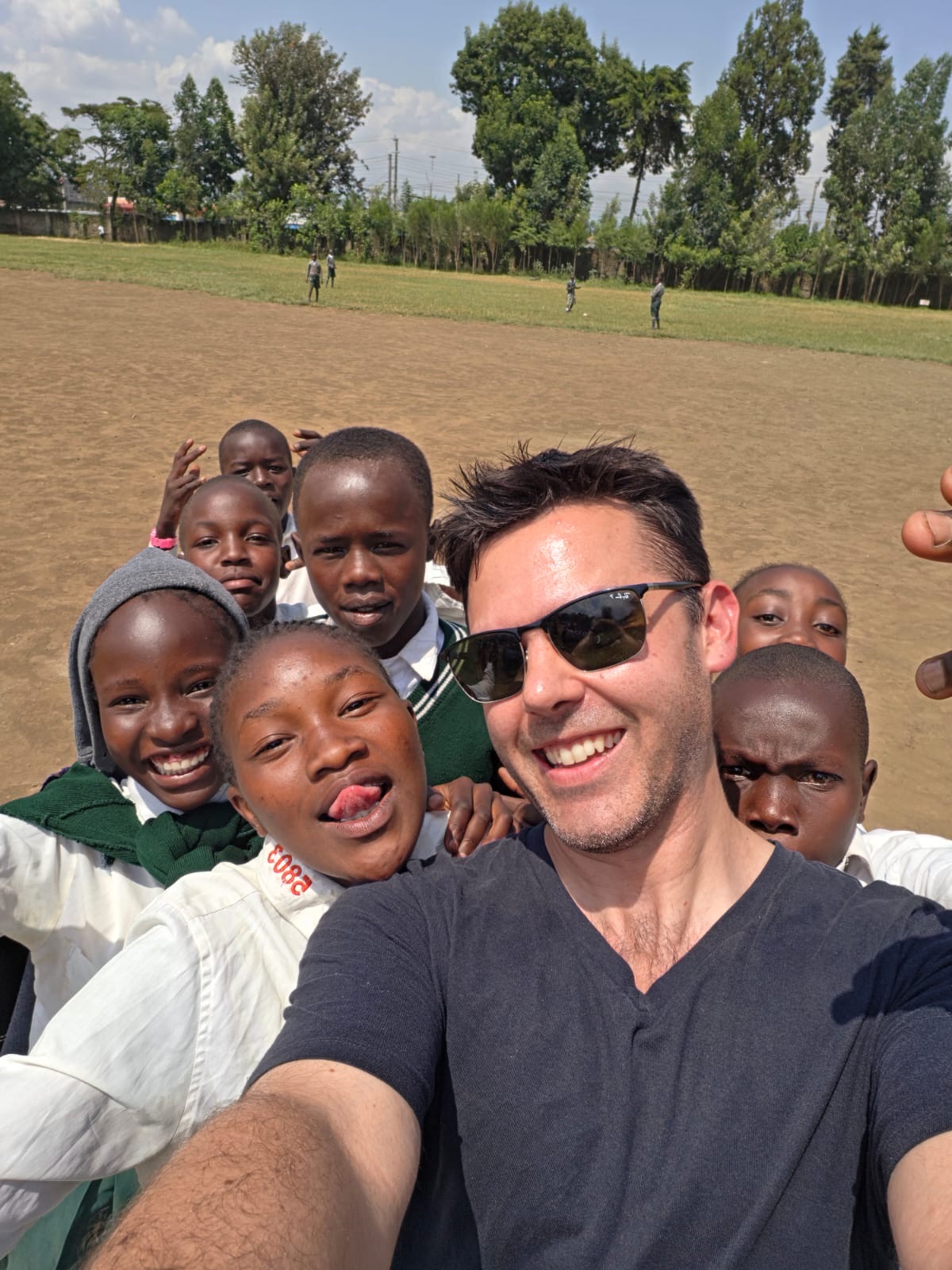 OnCourse students gathering for a group photo with a supporter in Kenya